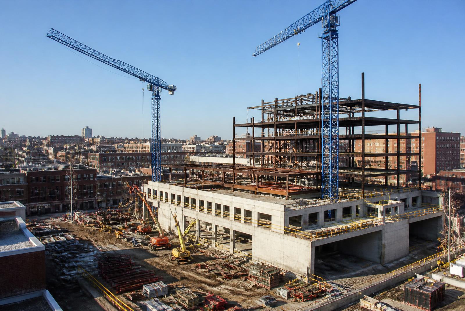 Tower cranes over a new mid-rise construction site in South End Charlotte